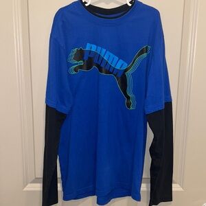 Puma boys size L. Black long sleeve with royal blue short sleeve top. Like new